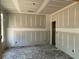 Spacious bedroom featuring drywall with natural light from a window at 4300 Easter Lily Ave Lot 11, Buford, GA 30519