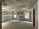 Spacious bedroom featuring drywall with natural light from two windows at 4300 Easter Lily Ave Lot 11, Buford, GA 30519