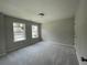 Bright bedroom offers soft carpet, two windows, and plenty of room to relax or work at 4300 Easter Lily Ave Lot 11, Buford, GA 30519