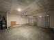 Spacious garage with an insulated door, water heater, and room for parking and storage at 4300 Easter Lily Ave Lot 11, Buford, GA 30519