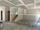 Spacious living room featuring drywall and stairs leading to the upper level at 4300 Easter Lily Ave Lot 11, Buford, GA 30519