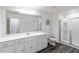 Bright bathroom with a double sink vanity, a glass enclosed shower, and modern fixtures at 891 Feldman Chase, Loganville, GA 30052