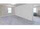 This spacious bedroom features neutral walls and carpet along with a sunny window at 891 Feldman Chase, Loganville, GA 30052