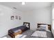 Well-lit bedroom features two twin beds, soft carpet, and simple wall decor at 891 Feldman Chase, Loganville, GA 30052