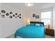 Charming bedroom with a wooden bed frame and vintage nightstands, and decorative plates at 891 Feldman Chase, Loganville, GA 30052
