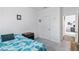 Bedroom with neutral carpet, a side table and a hallway view of the second story at 891 Feldman Chase, Loganville, GA 30052