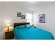 Cozy bedroom with a comfortable queen-size bed, warm lamps, and personal decor at 891 Feldman Chase, Loganville, GA 30052