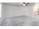 Spacious living room with plush carpeting, abundant natural light, and neutral walls at 891 Feldman Chase, Loganville, GA 30052