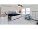 Main bedroom featuring a light-colored dresser and accents, a ceiling fan, and windows for natural light at 891 Feldman Chase, Loganville, GA 30052