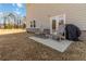 Cozy patio with outdoor seating and grill; perfect for relaxing and enjoying the backyard at 891 Feldman Chase, Loganville, GA 30052