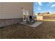 A backyard patio with comfortable chairs, ideal for relaxing or entertaining guests outdoors at 891 Feldman Chase, Loganville, GA 30052
