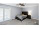 Cozy bedroom with a ceiling fan, sliding glass doors and large closet at 2006 Riverview Dr, Marietta, GA 30067