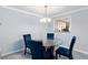 Dining area offering views of the kitchen through a pass-through window at 2006 Riverview Dr, Marietta, GA 30067