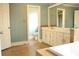 Bathroom boasts double sinks, spacious vanity, tile floors, and a luxurious soaking tub for relaxation at 3348 Summit Turf Ln, Snellville, GA 30078