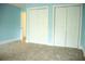 Bedroom features carpet and a closet with double doors at 3348 Summit Turf Ln, Snellville, GA 30078