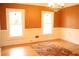 Traditional dining room featuring hardwood floors, two bright windows, chandelier and custom wainscoting at 3348 Summit Turf Ln, Snellville, GA 30078