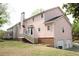 Exterior view of home with deck and attached garage at 3348 Summit Turf Ln, Snellville, GA 30078