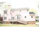 Exterior view of home with a deck, nice backyard, and brick foundation at 3348 Summit Turf Ln, Snellville, GA 30078