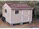 Outdoor shed with windows and a door for extra storage space at 3348 Summit Turf Ln, Snellville, GA 30078