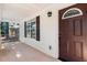 Welcoming front porch with a brown door and a security system at 510 Mountainview Dr, Covington, GA 30016