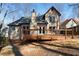 Backyard view from wooden deck showing the house and a well-manicured lawn at 216 Tennis Court Nw Ln, Kennesaw, GA 30144