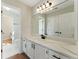 Bathroom featuring a large mirror, modern vanity, and updated fixtures at 216 Tennis Court Nw Ln, Kennesaw, GA 30144