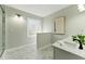Bathroom featuring modern fixtures, neutral walls, a vanity, and a glass-enclosed shower with a view of artwork at 216 Tennis Court Nw Ln, Kennesaw, GA 30144