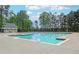 Large community pool, perfect for relaxation and recreation, surrounded by lush greenery at 216 Tennis Court Nw Ln, Kennesaw, GA 30144