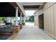 A covered patio space with picnic tables near the pool, perfect for outdoor gatherings and relaxation at 216 Tennis Court Nw Ln, Kennesaw, GA 30144