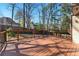Spacious wooden deck perfect for outdoor entertaining with wood railings, overlooks backyard at 216 Tennis Court Nw Ln, Kennesaw, GA 30144
