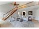 Spacious living room with vaulted ceilings, staircase, and modern decor at 216 Tennis Court Nw Ln, Kennesaw, GA 30144