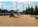 Community playground with slides and swings, nestled among the trees for outdoor fun at 216 Tennis Court Nw Ln, Kennesaw, GA 30144