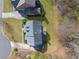An aerial view of a single-Gathering home with a backyard and an attached garage on a sunny day at 4675 Allistair Dr, Cumming, GA 30040