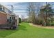Spacious backyard with lush lawn and mature trees, offering privacy and room for outdoor activities at 4675 Allistair Dr, Cumming, GA 30040