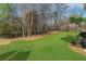 Green backyard space with natural beauty, perfect for outdoor activities and relaxation at 4675 Allistair Dr, Cumming, GA 30040