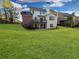 Expansive backyard featuring a well-maintained lawn, perfect for outdoor activities and relaxation at 4675 Allistair Dr, Cumming, GA 30040