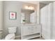 Bathroom with a toilet, vanity, tile flooring, and shower-tub combo at 4675 Allistair Dr, Cumming, GA 30040
