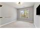 Neutral bedroom with window and TV at 4675 Allistair Dr, Cumming, GA 30040