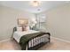 Cozy bedroom with decorative pillows and natural light at 4675 Allistair Dr, Cumming, GA 30040