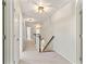 Hallway featuring carpet flooring, neutral walls, and decorative lighting fixtures at 4675 Allistair Dr, Cumming, GA 30040
