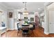 Bright kitchen with stainless steel appliances, stylish chandelier, and table with seating at 4675 Allistair Dr, Cumming, GA 30040