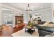 Cozy living room with brick fireplace, hardwood floors, and open concept design at 4675 Allistair Dr, Cumming, GA 30040