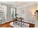 Bright home office with hardwood floors, natural light, and stylish decor at 4675 Allistair Dr, Cumming, GA 30040
