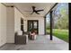 Covered patio featuring a modern fire pit and cozy seating area, perfect for relaxing and entertaining at 4675 Allistair Dr, Cumming, GA 30040