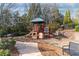 Community playground with slides, climbing structures, and benches for parents to relax at 4675 Allistair Dr, Cumming, GA 30040