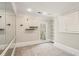 Empty bedroom featuring plush carpeting, recessed lighting, and geometric wallpaper design at 5120 Post Oak Tritt Ne Rd, Roswell, GA 30075