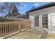 Back deck with backyard access and wooden railing at 6600 Commonwood Pl, Atlanta, GA 30349