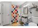 Colorful bathroom featuring a vibrant shower curtain, and quirky decorations at 285 Centennial Olympic Park Nw Dr # 904, Atlanta, GA 30313