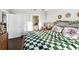 Bright bedroom features a checkered bedspread, and an ensuite bathroom at 285 Centennial Olympic Park Nw Dr # 904, Atlanta, GA 30313