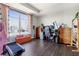 Spacious bedroom featuring a large window with a city view, hardwood floors, and modern decor at 285 Centennial Olympic Park Nw Dr # 904, Atlanta, GA 30313